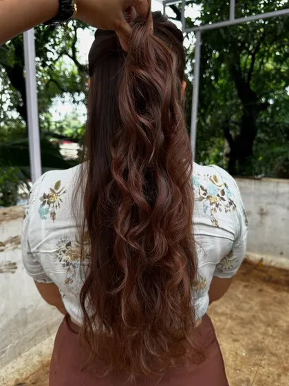 The ponytail view of her wedding guest style.