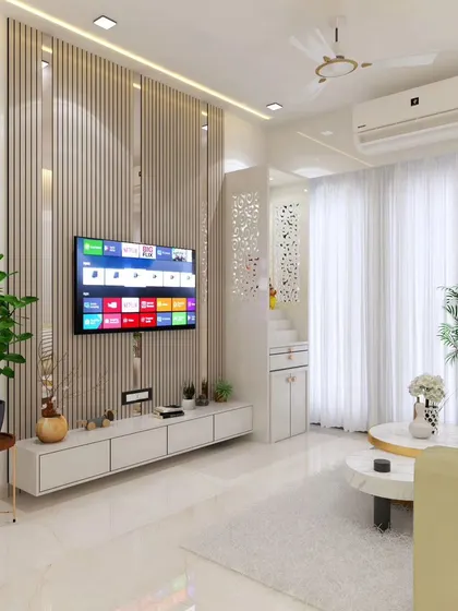 This living room design showcases our expertise in creating multi-functional spaces. We've seamlessly integrated a modern TV unit with vertical louvers and a compact, elegant mandir, proving that thoughtful design can accommodate both contemporary needs and traditional values in a single, harmonious layout.