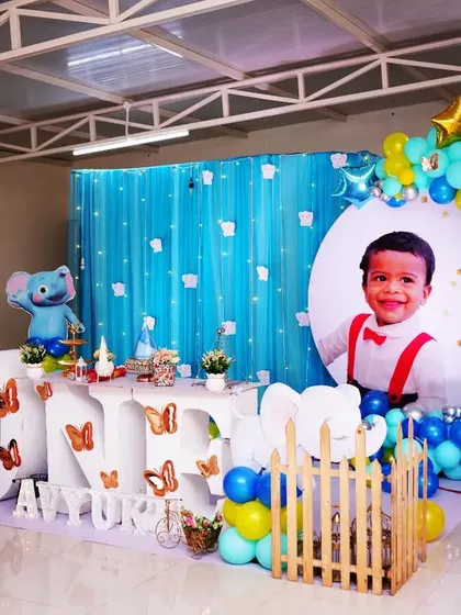 Another adorable baby elephant theme, this time for Avyukt's first birthday. We used a large photo cutout of the birthday boy, a "ONE" table, and elephant props to make his day special.