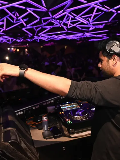 Pointing out to the crowd, connecting with the people I'm playing for under the unique geometric ceiling of Hex.