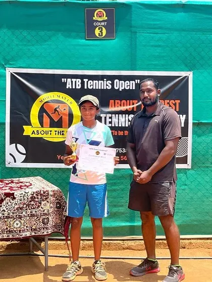 A finalist being presented with his trophy by our coach.