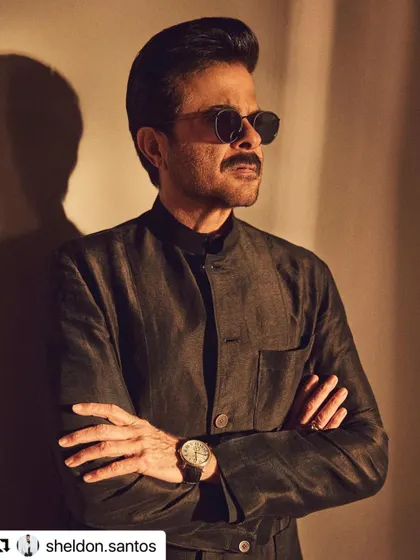 A close-up shot of Anil Kapoor. Even with sunglasses, the perfectly styled hair stands out.