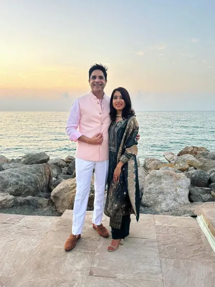 A lovely photo with a guest at a beachside wedding. The golden hour sunset created a perfect, warm glow for this beautiful celebration.