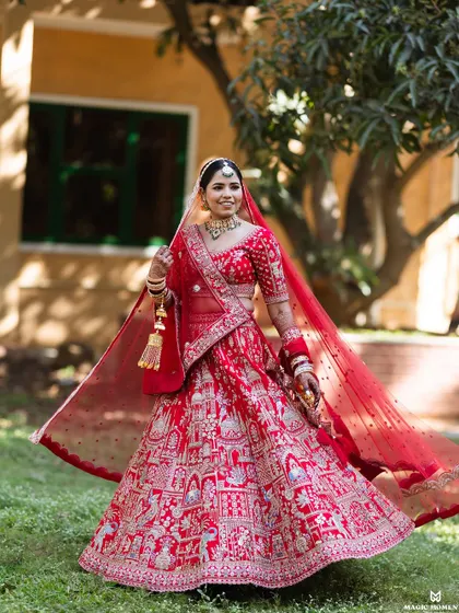 I love capturing the pure joy and elegance of a bride on her wedding day. This twirl shot shows the beautiful movement of the lehenga and the bride's radiant smile.