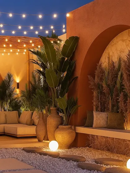 This 3D render imagines a Mediterranean-inspired terrace at night, with warm terracotta walls, string lights, and large urns.