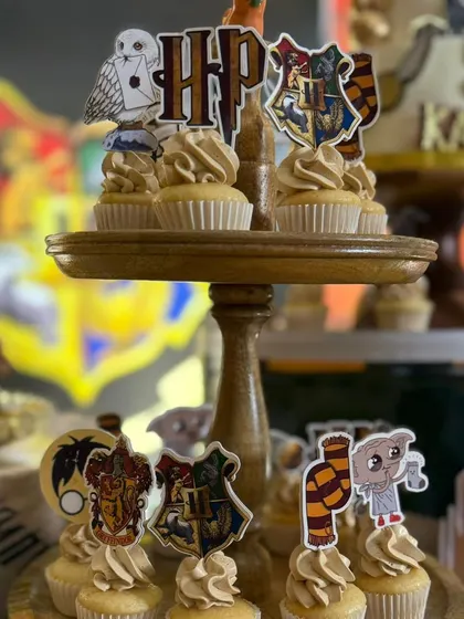 A closer look at the Harry Potter themed cupcake toppers, featuring the Hogwarts house crests, Hedwig, and Dobby.