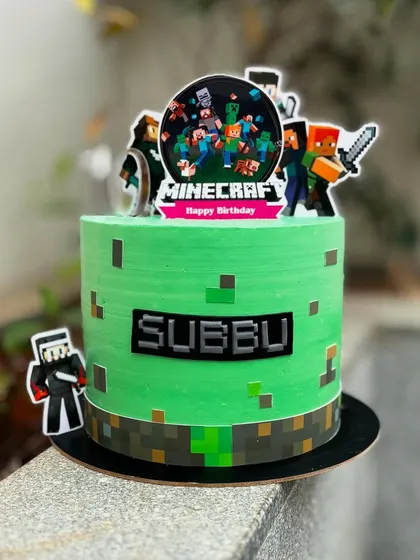 Crafting the perfect treat with this Minecraft cake. I used a pixelated design on the buttercream and added character toppers to bring the video game to life.