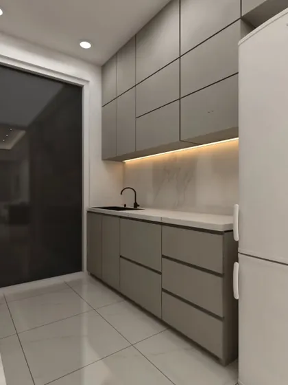 A minimalist kitchen with handleless, grid-patterned upper cabinets. The design uses a monochromatic color scheme and under-cabinet lighting to create a sleek and contemporary feel.