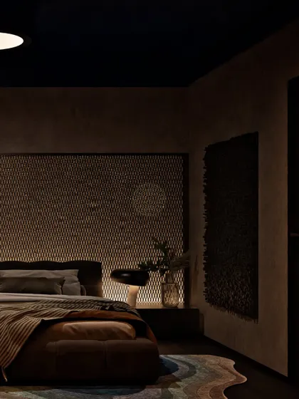 The lighting in this guest bedroom is designed to be soft and dramatic. The textured wall and dark ceiling create a cozy, cocoon-like feeling, perfect for a restful night.