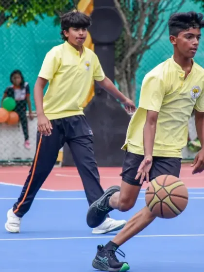 A young player dribbles the ball down the court during our Interschool Basketball Tournament, showcasing his speed and control.