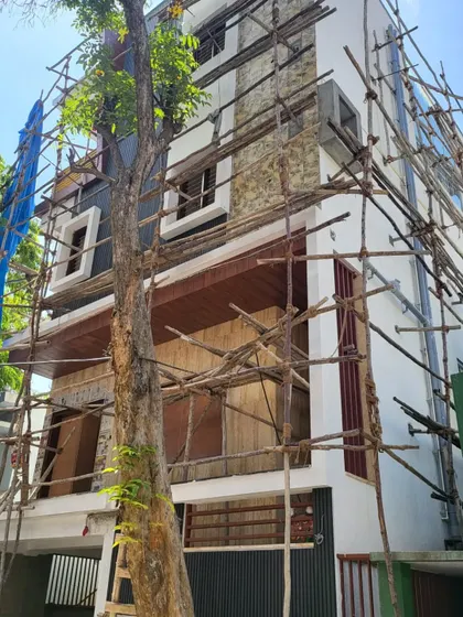 A full view of the building during the exterior finishing phase.