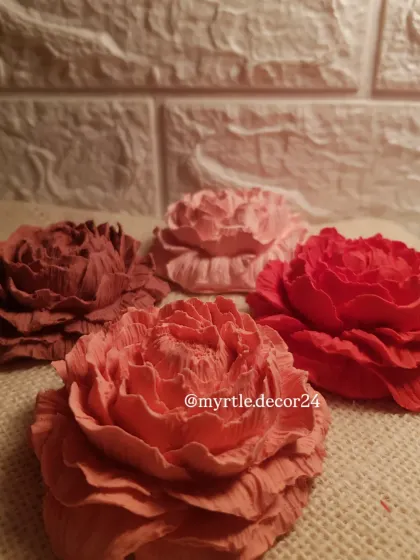 A closer look at the rich colors and textures of our Peony aroma diffusers. Each one is hand-poured and colored, making every flower unique.