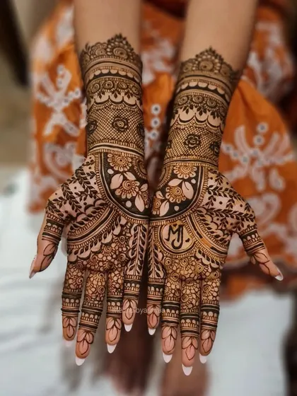 I love hiding initials in my bridal designs. Here, I incorporated 'M' and 'J' into the palms for a special, personal touch.