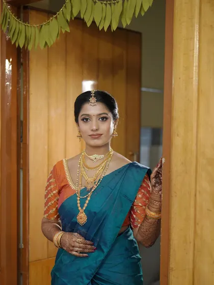 A full view of the bride's look. My services include ensuring every element, from the makeup to the saree draping, is perfect for your big day.