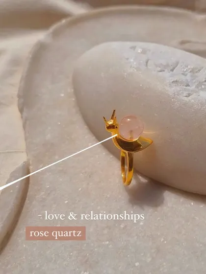 The 'snáil' ring in Rose Quartz for love and Peach Moonstone for luck.