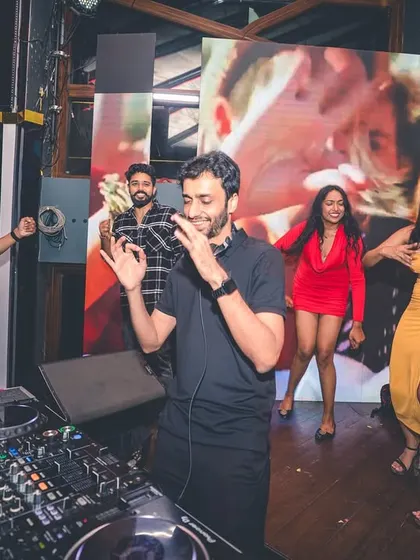 The crowd dancing right next to the DJ booth. I love it when the energy is this close and personal.