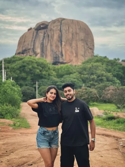 A couple enjoying the stunning natural backdrop of the Ramanagara hills, just a short walk from our resort. The location is perfect for memorable photos.