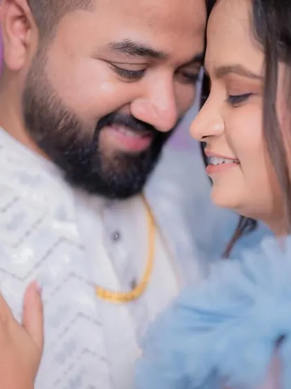Wrapped in blue hues for a love that's true. A close-up, romantic moment between the couple on their engagement day.