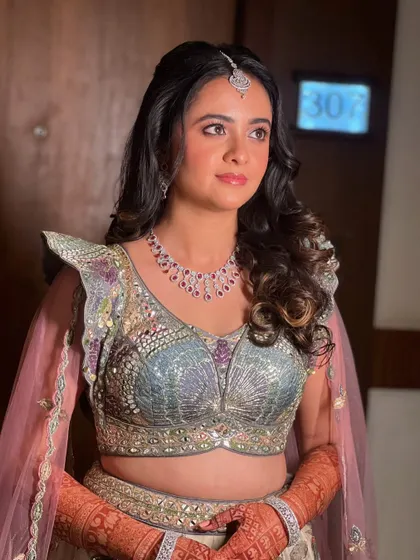 Another angle of this beautiful look, showcasing the intricate details of her outfit.