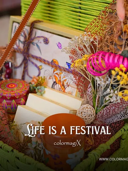 A close-up of the green jute hamper with the message "Life is a festival." We believe in celebrating every moment with beautiful and thoughtful gifts.