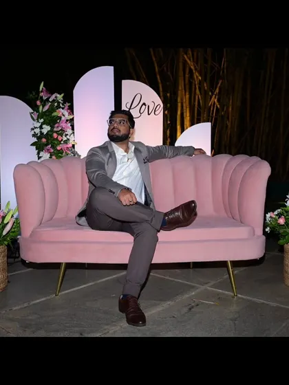 A fun, posed shot on a pink sofa, "Waiting for Love".