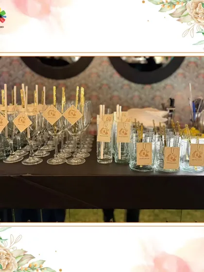 Elegant glassware prepared with custom stirrers and tags, demonstrating our commitment to a cohesive and branded event experience.