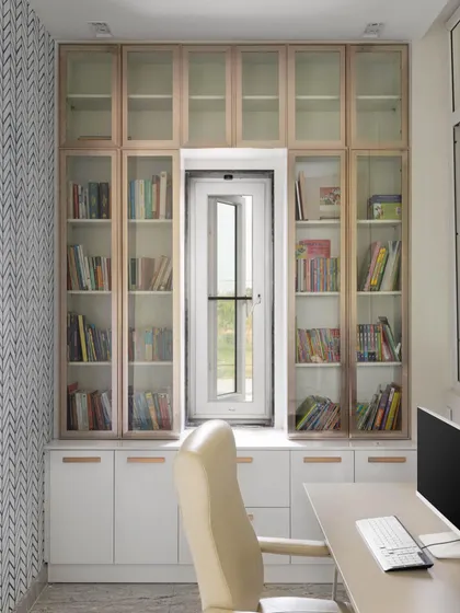 A productive home office needs to be both ergonomic and inspiring. For the Lakshya project, we designed this study with ample storage, including glass-fronted bookshelves built around a window to maximize natural light. The sleek, modern furnishings create a workspace that is comfortable and stylish.