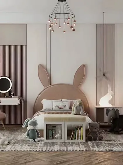 A sweet and stylish girl's room with a bunny-ear headboard and soft, neutral colors. The design includes a small vanity and whimsical lighting for a charming effect.