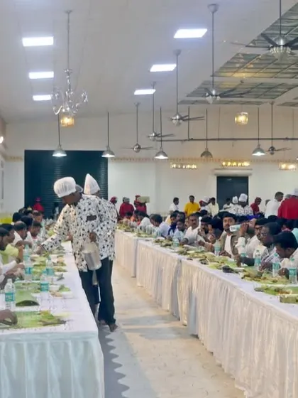 Guests seated and ready for the meal service to begin. The uniformity of the setup creates a visually appealing and organized dining experience.