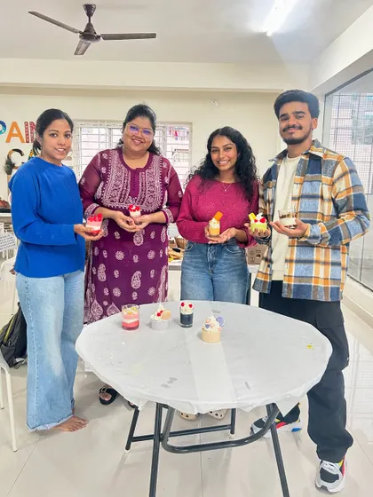 Another happy group of friends with their handmade candles, ready to be taken home.