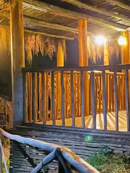 The cozy balcony of the mud house at night, a perfect place to relax after a day of exploring.