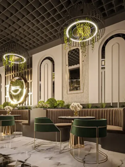 This view focuses on the cozy booth seating, with plush velvet upholstery and integrated planters. The design uses mirrors and lighting to make the space feel both intimate and open.