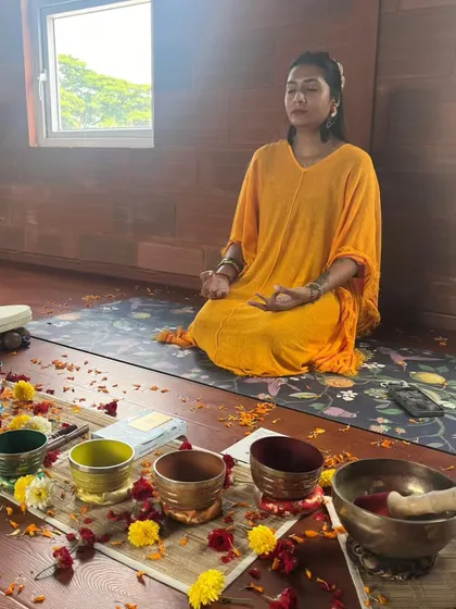 Seated in meditation before a session begins, I center myself to become a clear channel for the healing sounds. This personal practice is essential for me to hold space for others effectively.