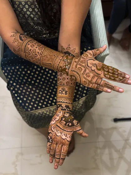 Another view of the custom RCB bridal mehendi, showing how we can seamlessly blend personal passions with traditional henna art.
