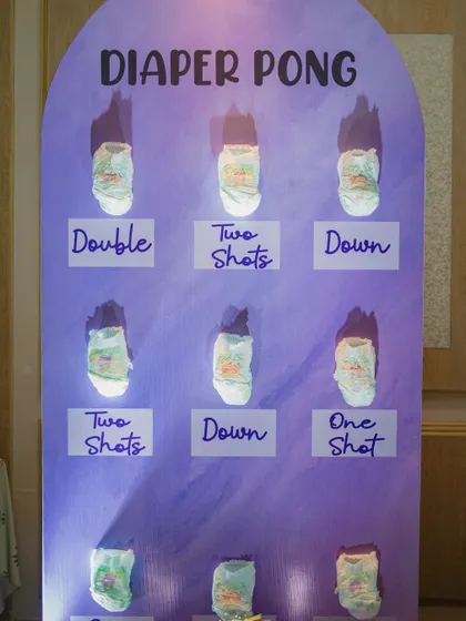 Who says baby showers can't have a little friendly competition? This 'Diaper Pong' game station is always a huge hit, bringing so much laughter and energy to the party. I handle the entire setup for you.