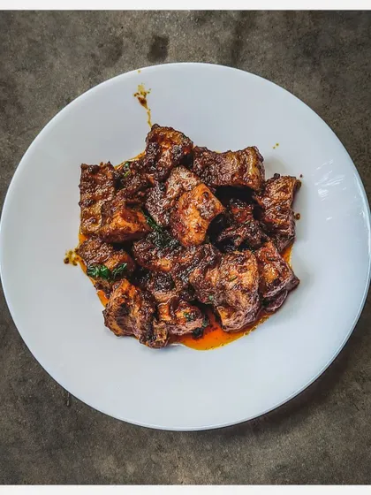 My Chettinad Pork Belly Fry is an adaptation of the classic 'Uppu Kari'. I stir-fry pork belly chunks in exotic Chettinad spices until they are perfectly cooked and delicious.