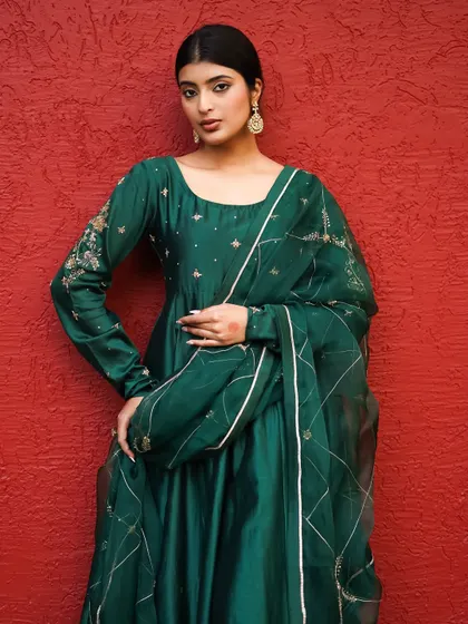 A full-length portrait that captures the complete look with confidence. The model's pose and direct gaze make this a strong image for a brand campaign.