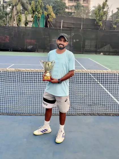 Coach Subhash Rao celebrating his tournament victory. Having coaches who are active and successful competitors is a core part of our academy's strength.