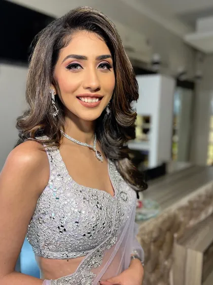 A happy and confident portrait, her Roka makeup looking absolutely perfect.