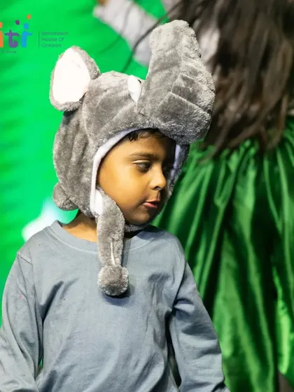A close-up of a child in a cute elephant costume, a favorite among the audience.