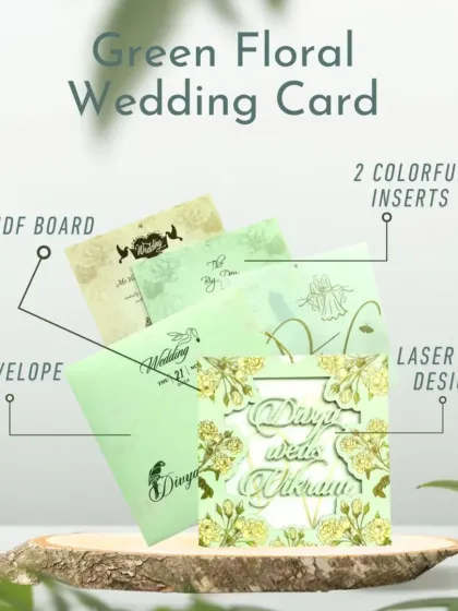 A green floral wedding card with a delicate laser-cut design. This invite includes an MDF board, two colorful inserts, and a matching envelope.