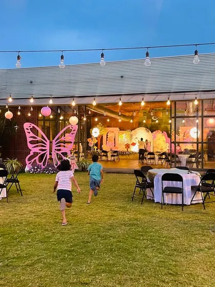 Kids running freely and enjoying the beautiful outdoor space at the enchanted garden party. We design events with plenty of room for fun and games.