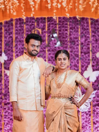 A more formal portrait of the couple on their butterfly-themed stage.