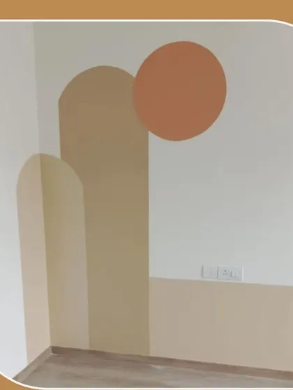 A modern and minimalist wall art design using simple geometric shapes and a neutral colour palette to create a subtle yet stylish feature.