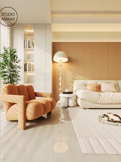 We love playing with form and color. This living room features a sculptural orange armchair that adds a vibrant, playful touch to the otherwise serene and neutral space. The polished floor and minimalist decor keep the look sophisticated and modern.