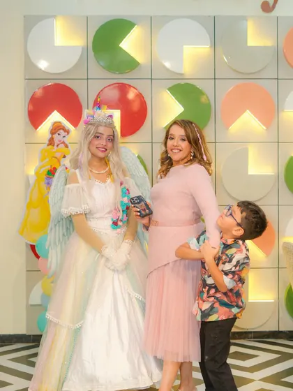 A family poses with our enchanting unicorn princess, a special addition to any princess or unicorn-themed party.