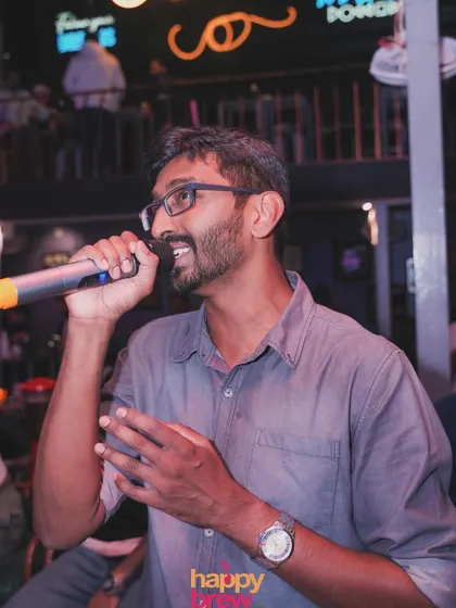 Another angle of this singer enjoying his time on the mic.
