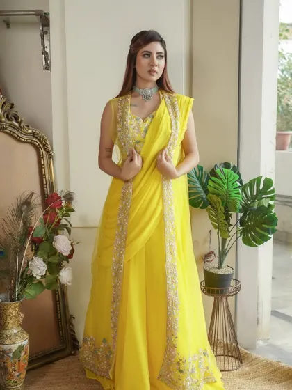 Radiant in yellow for a Haldi or Mehendi function. The makeup is kept clean and bright to complement the sunny color of the outfit.
