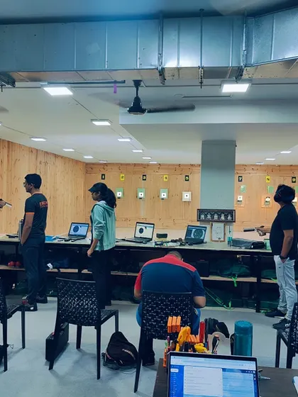Shooters line up for pistol practice, each focused on their target. This wide shot demonstrates the capacity of my range and the serious training environment for upcoming national competitions.