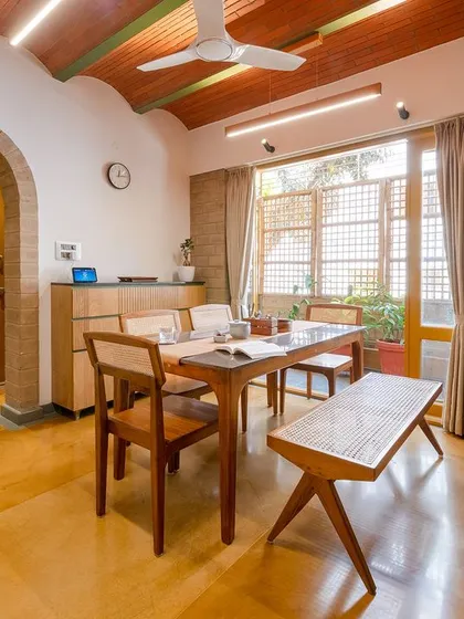 Another view of the dining area, showing the jack-arch roof and arched doorway.